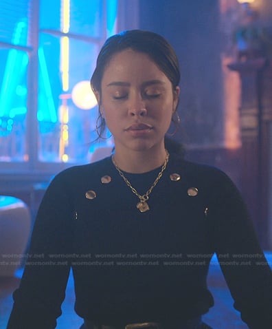 Mariana’s black ribbed sweater with gold buttons on Good Trouble