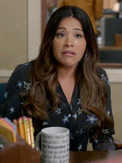 Nell’s black star print shirt on Not Dead Yet