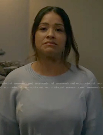 Nell’s blue star sweater on Not Dead Yet