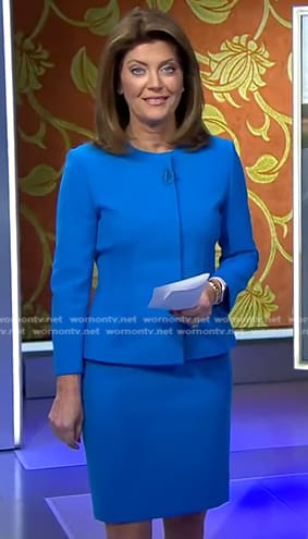 Norah’s blue peplum jacket and skirt on CBS Evening News