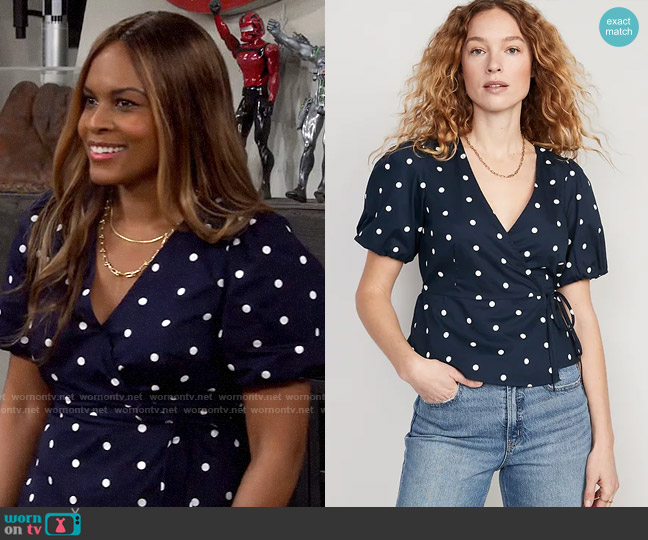 Old Navy Waist-Defined Puff-Sleeve Tie-Wrap Blouse in Navy Dots worn by Janelle (Nefetari Spencer) on The Neighborhood