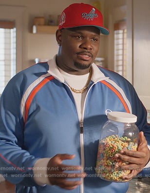 Sherm’s blue track jacket on Grand Crew