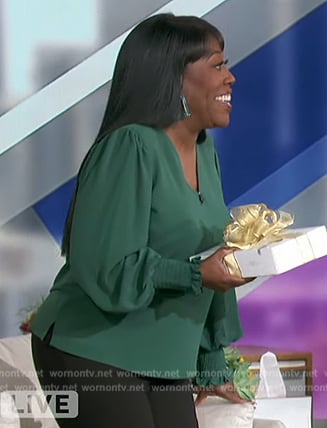 Sheryl’s green smocked cuff top on The Talk