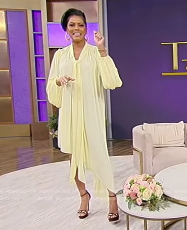 Tamron’s yellow tie neck asymmetric dress on Tamron Hall Show
