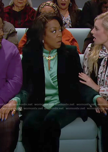 Tina’s green wrap blouse and velvet blazer on The Neighborhood