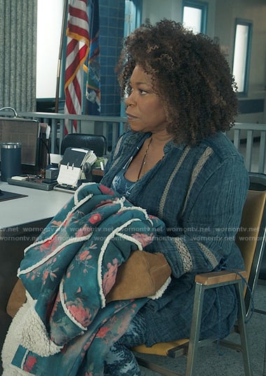Vi’s blue lace-inset shirt and floral sherpa coat on The Equalizer