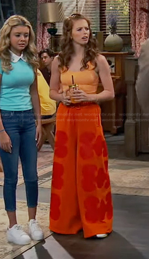 Victoria’s orange wide-leg pants on Bunkd