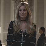 Willa’s black stripe knit cardigan and skirt on Succession