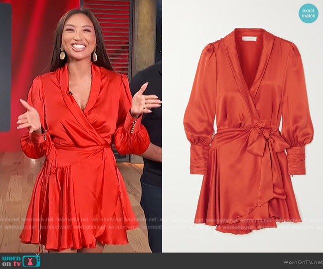 Zimmermann Ruffled silk-satin mini wrap dress worn by Jeannie Mai on Access Hollywood