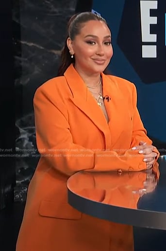 Adrienne’s orange oversized blazer on E! News