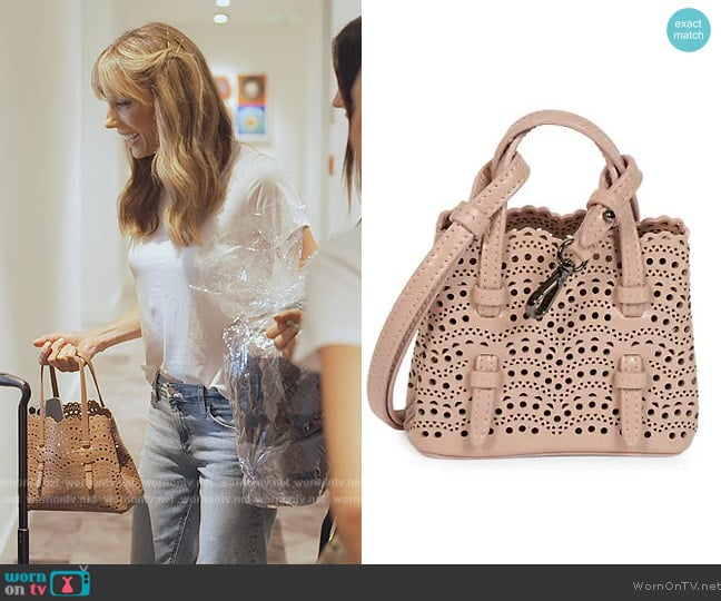 Alaia Mina Mini Cutout Top Handle Bag worn by Jennifer Flavin Stallone on The Family Stallone