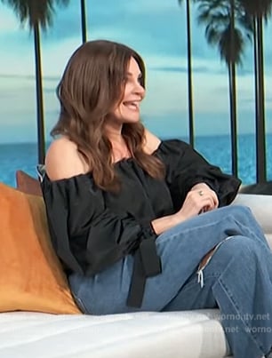 Betsy Brandt’s black off shoulder top on Access Hollywood