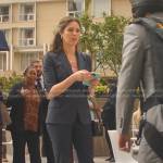 Blair Andrews’s navy elbow sleeve blazer and pants on 9-1-1