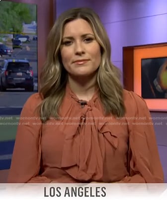 Erin McLaughlin’s orange tie neck blouse on Today
