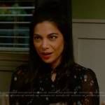 Helen’s black floral blouse on True Lies