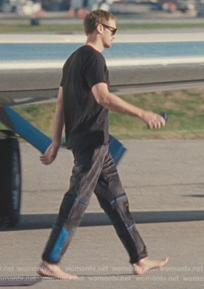 Lukas’s black track pants