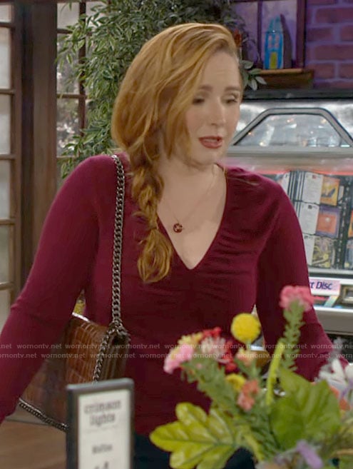 Mariah’s red v-neck sweater and brown croc bag on The Young and the Restless
