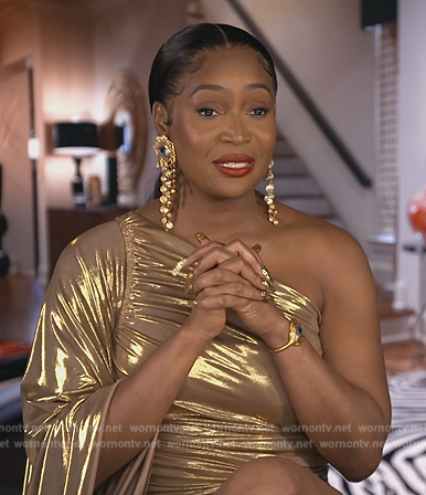 Marlo’s gold metallic confessional dress on The Real Housewives of Atlanta