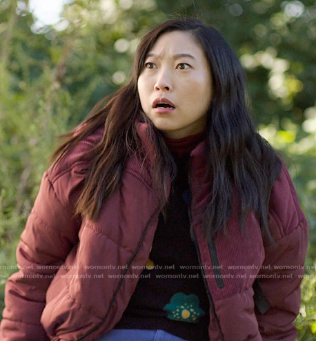 Nora’s burgundy puffer jacket with corduroy patches on Awkwafina is Nora From Queens
