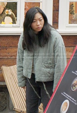 Nora’s green quilted jacket on Awkwafina is Nora From Queens