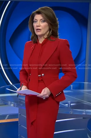 Norah’s red chain embellished blazer on CBS Evening News