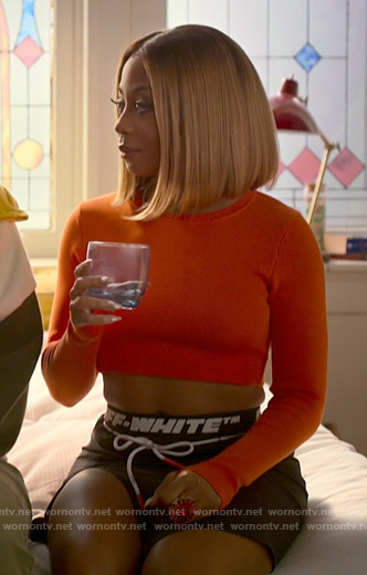 Renee’s orange crop top and Off White logo skirt on Run the World