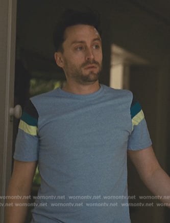 Roman’s blue striped tee on Succession