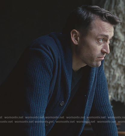 Roman’s navy knit cardigan on Succession