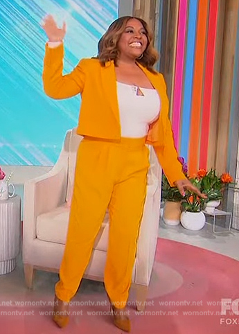 Sherri’s orange cropped blazer on Sherri