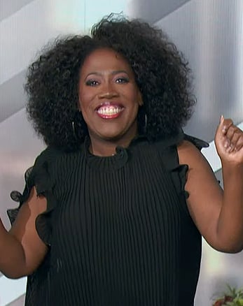 Sheryl’s black pleated ruffle top on The Talk