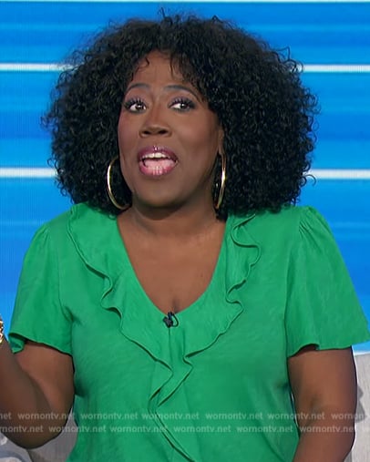 Sheryl’s green ruffle front blouse on The Talk