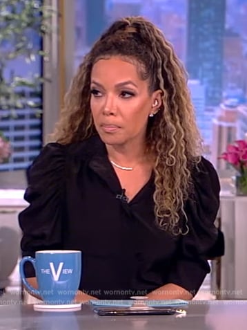 Sunny’s black puff sleeve top and skirt on The View