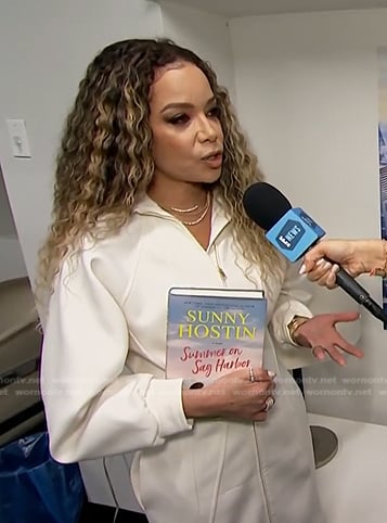 Sunny Hostin’s white zip front dress on E! News