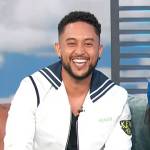 Tahj Mowry’s white sailors jacket on Access Hollywood