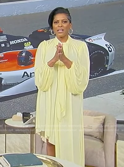 Tamron’s yellow asymmetric tie neck dress on Tamron Hall Show