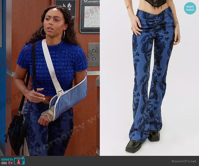 BDG Printed Ruched Dipped V-Front Flare Jean in blue worn by Talia Hunter (Aketra Sevellian) on Days of our Lives