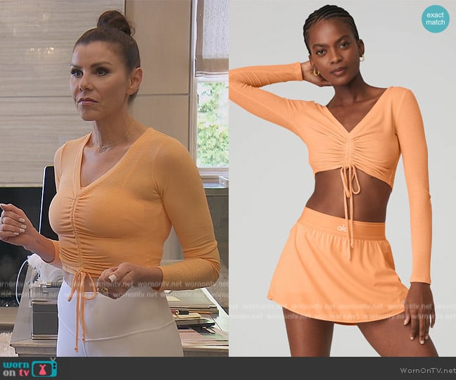 Alo Yoga Ribbed Cinch Cropped Long Sleeve Top worn by Heather Dubrow on The Real Housewives of Orange County