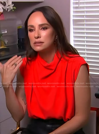 Catt Sadler’s red sleeveless top on Access Hollywood