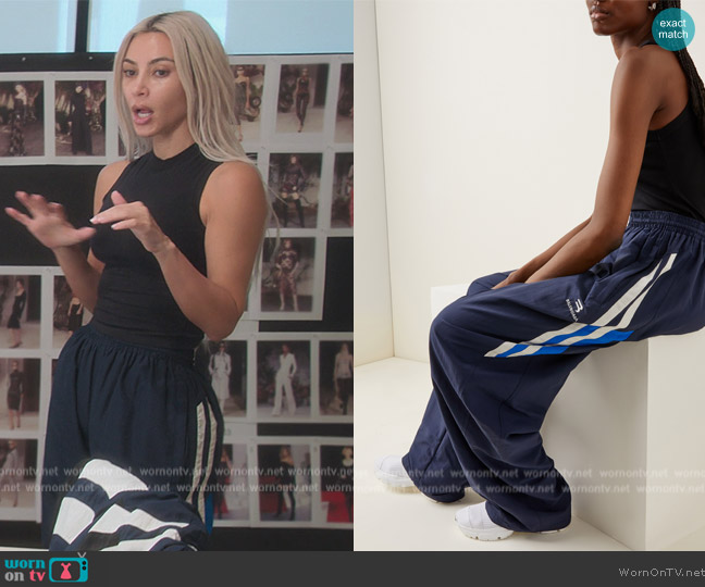 Balenciaga Striped Shell Track Pants worn by Kim Kardashian (Kim Kardashian) on The Kardashians