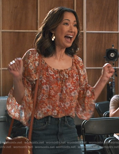 Eleanor’s mom’s red floral print top on Never Have I Ever