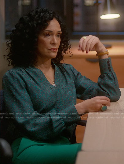 Francey’s green printed blouse and logo belt on So Help Me Todd