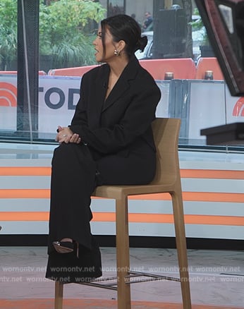 Kourtney’s black buckle detail pants on The Kardashians
