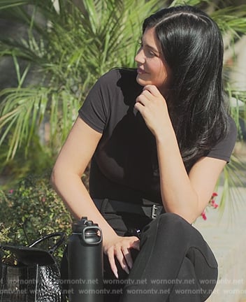 Kylie’s black leather bag and boots on The Kardashians
