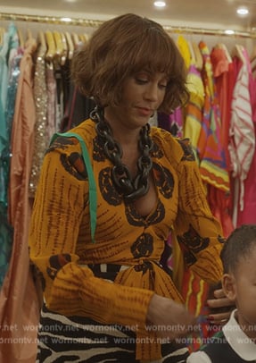 Lisa’s yellow printed blouse and zebra stripe skirt on And Just Like That