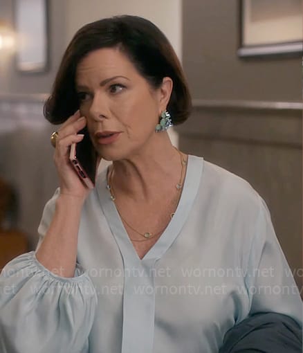 Margaret’s light blue v-neck blouse on So Help Me Todd