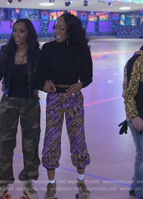 Sanya’s purple baroque printed pants on The Real Housewives of Atlanta