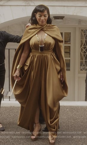 Seema’s gold satin cutout dress on And Just Like That