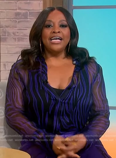 Sherri’s purple zebra stripe blouse and pants on Sherri
