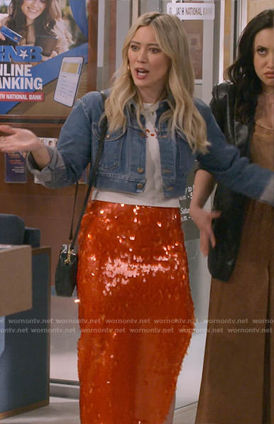 Sophie’s cropped denim jacket and red sequin skirt on How I Met Your Father