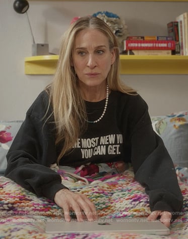Carrie’s multicolored knit wrap on And Just Like That